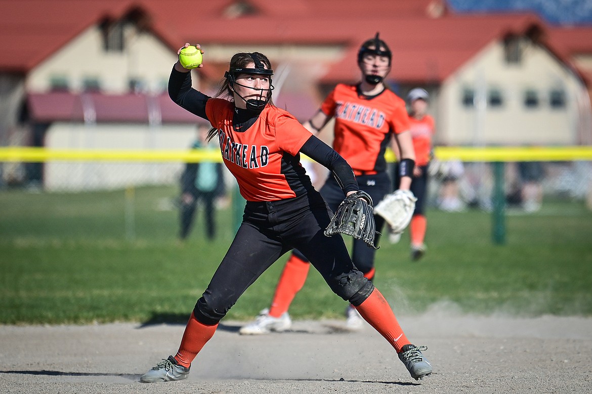 Flathead third baseman Ava Bessen (4) throws to first for an out after fielding a grounder against Glacier at Glacier High School on Thursday, April 18. (Casey Kreider/Daily Inter Lake)