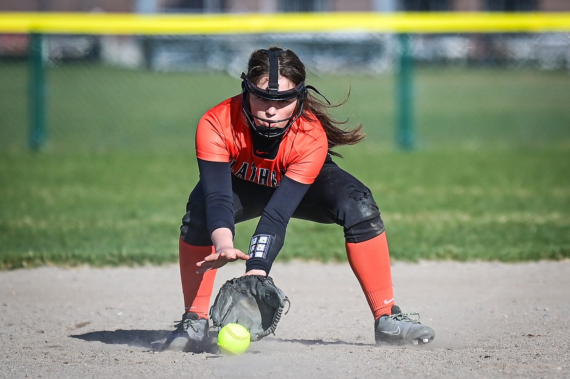 Flathead third baseman Ava Bessen (4) fields a a grounder against Glacier at Glacier High School on Thursday, April 18. (Casey Kreider/Daily Inter Lake)