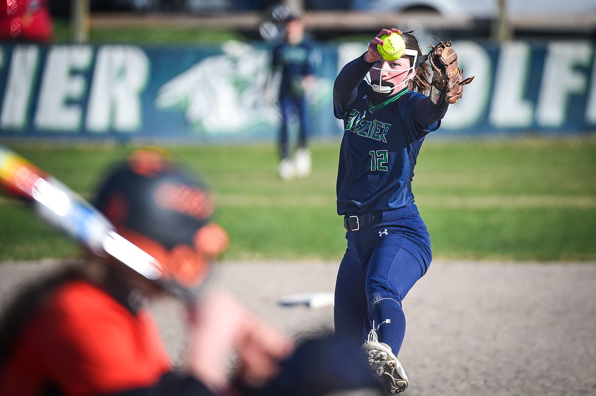 Glacier's Ella Farrell (12) delivers in the second inning against Flathead at Glacier High School on Thursday, April 18. (Casey Kreider/Daily Inter Lake)