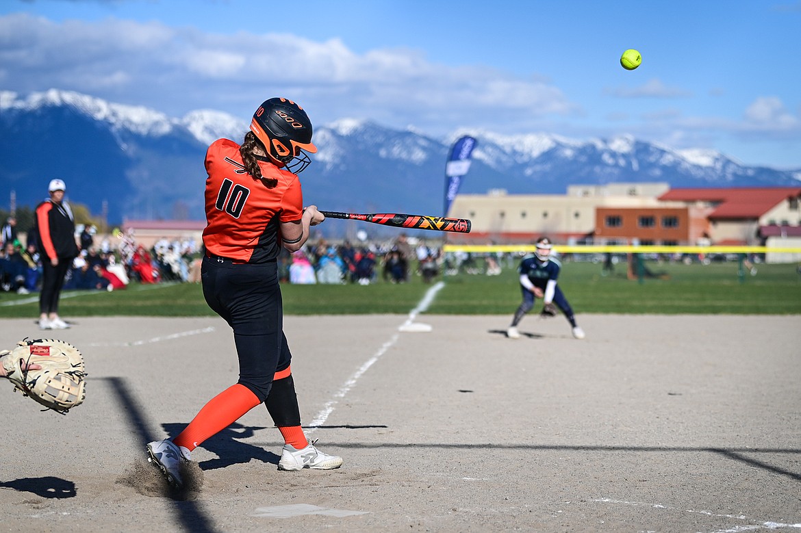 Flathead's Kaidyn Lake (10) connects on a two-run home run in the fourth inning against Glacier at Glacier High School on Thursday, April 18. (Casey Kreider/Daily Inter Lake)