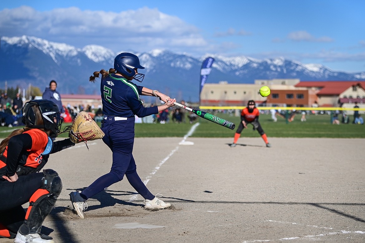 Glacier's Kenadie Goudette (2) connects on a two-run home run in the third inning against Flathead at Glacier High School on Thursday, April 18. (Casey Kreider/Daily Inter Lake)
