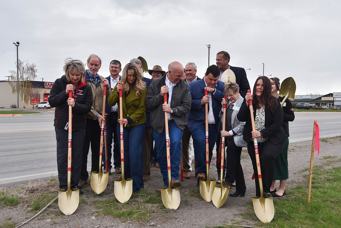 Members of the Evergreen community celebrate the start of a project to build sidewalks along U.S. 2 on April 19, 2024. (Kate Heston)