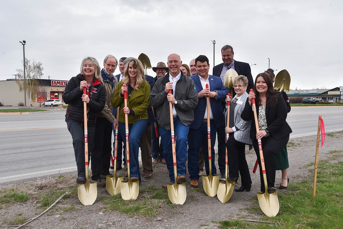 Members of the Evergreen community celebrate the start of a project to build sidewalks along U.S. 2 on April 18, 2024. (Kate Heston/Daily Inter Lake)