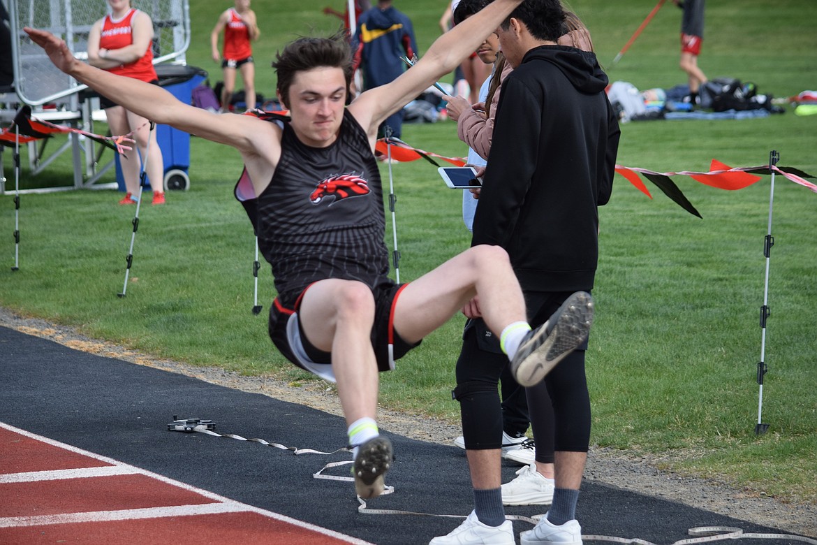 Lind-Ritzville track and field athlete Jackson Blanton does a long jump at the track meet Wednesday afternoon on Broncos home territory.