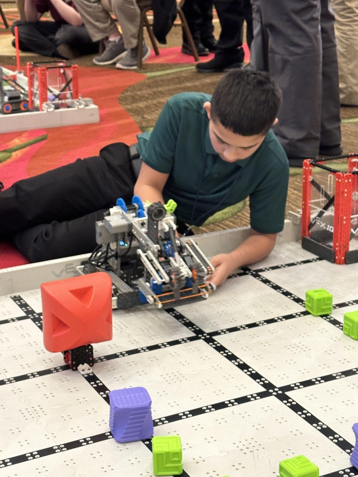 A McFarland Middle School student inspects the robot the Technology Student Association club built for the TSA state competition that took place in Seattle from March 13 to March 16.