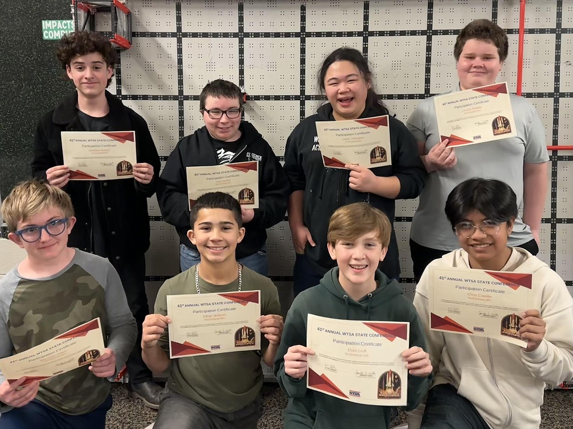Members of McFarland Middle School’s Technology Student Association club hold up certificates after the students took 4th place at the TSA state conference in Seattle last month.