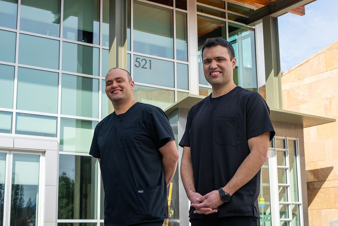 Brothers Deren Guerrero, left, and Daniel Guerrero pose for a photo outside of the Meyer Health and Sciences Building at North Idaho College’s Coeur d’Alene campus.