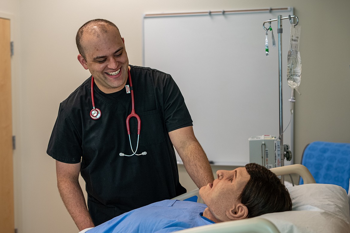 Deren Guerrero examines a medical dummy in a nursing lab in the Meyer Health and Sciences Building at NIC’s Coeur d’Alene campus.