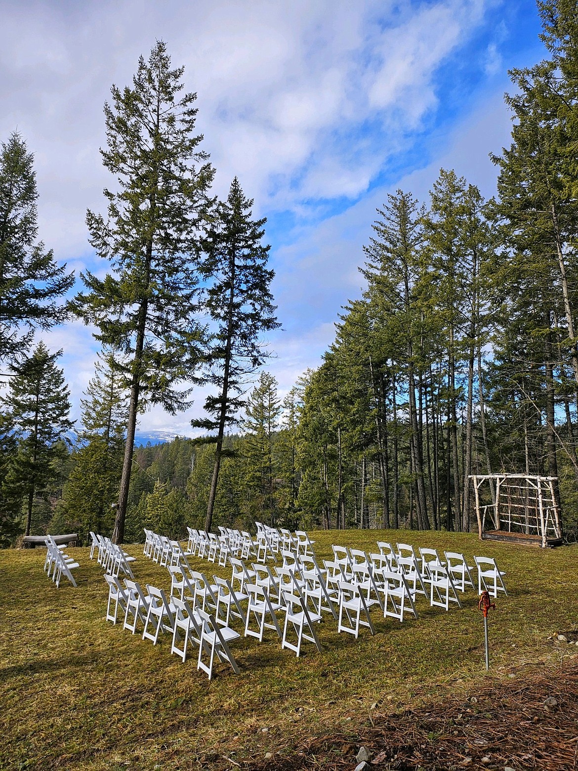 Chairs set out on the lawn at Pioneer Lodge for a wedding ceremony.