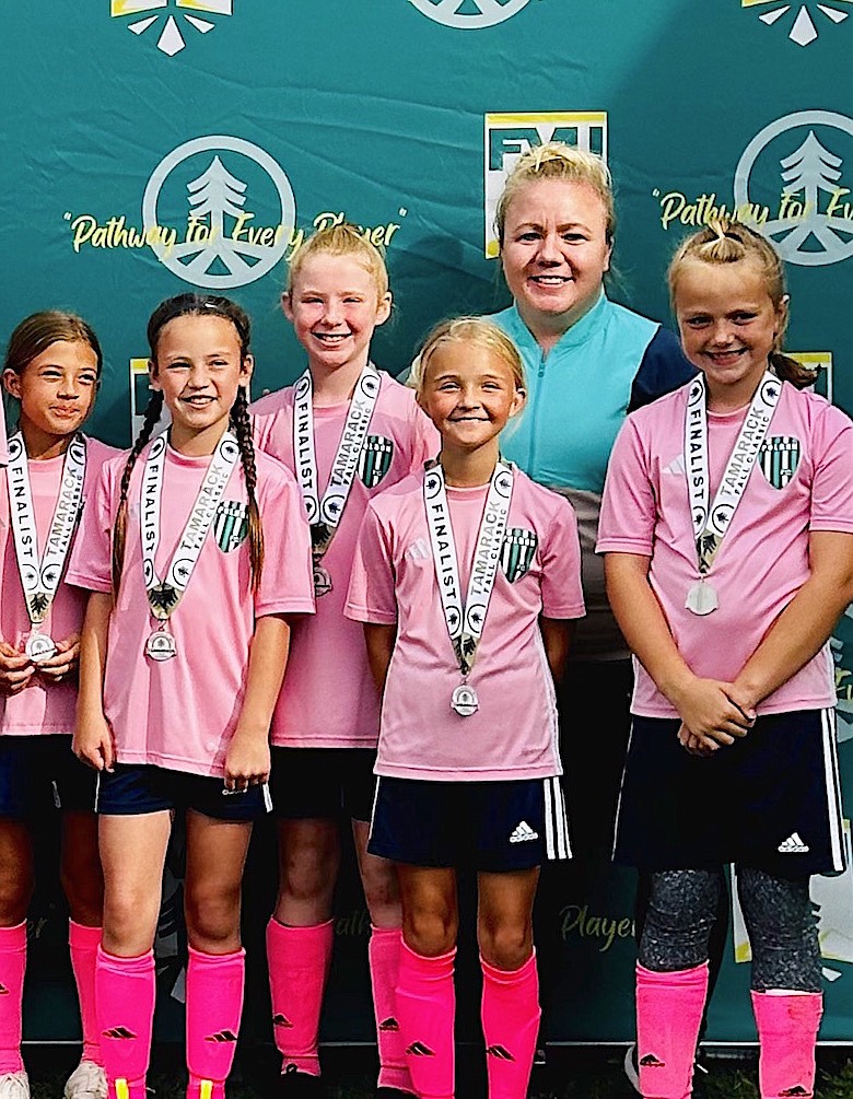 Polson High's new head soccer coach Heather Howell with some members of the Polson FC U-12 Girls' Soccer team that took second at the Tamarack Tournament in Kalispell last fall.