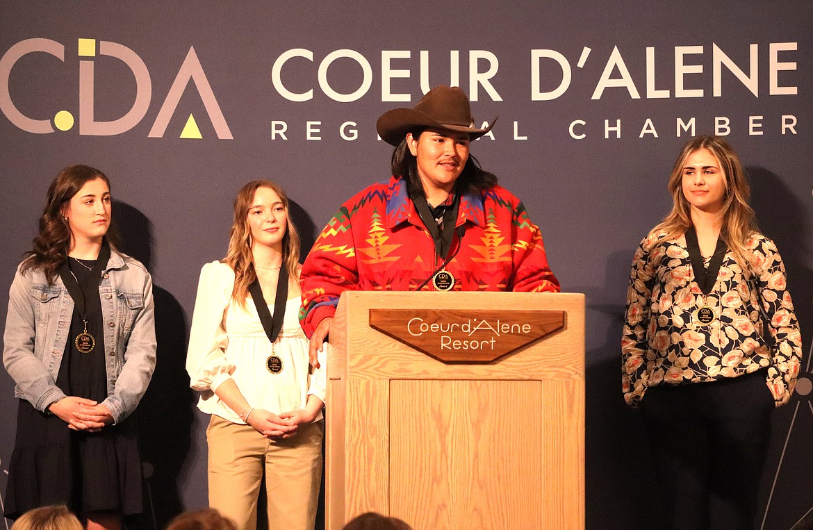 Tsones Nomee of Lakeside High School addresses the crowd at the Coeur d’Alene Regional Chamber’s annual scholarship breakfast at The Coeur d’Alene Resort on Friday. Joining Nomee on stage, from left, are Ashley Kerns of Lake City High School, Andi Jane Howard of Coeur d'Alene High School and Abigail Fitzgerald of Coeur d'Alene Charter Academy.