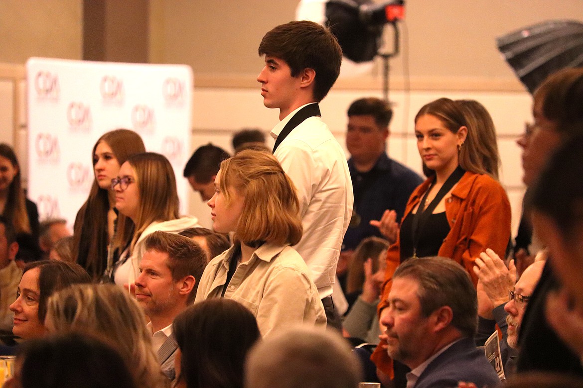 Students stand during the Coeur d’Alene Regional Chamber’s annual scholarship breakfast at The Coeur d’Alene Resort on Friday.