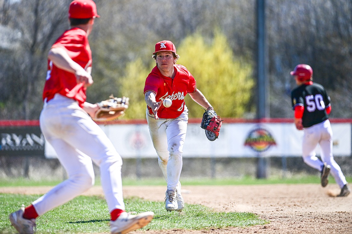 Lakers AA first baseman Michael Owens (8) tosses to pitcher Carter Schlegel (5) for the final out of the game against the Cranbrook Bandits at Griffin Field on Saturday, April 20. (Casey Kreider/Daily Inter Lake)