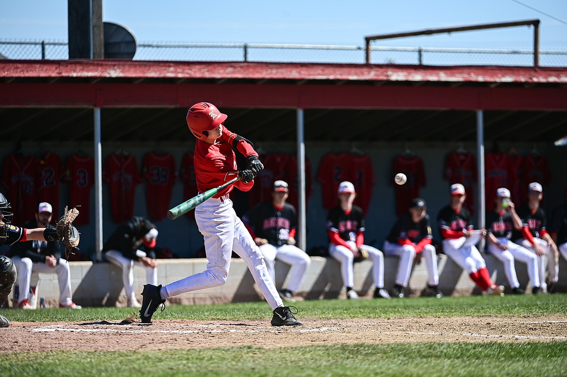 Lakers AA's Kaden Drish (6) drives in two runs with a single in the third inning against the Cranbrook Bandits at Griffin Field on Saturday, April 20. (Casey Kreider/Daily Inter Lake)