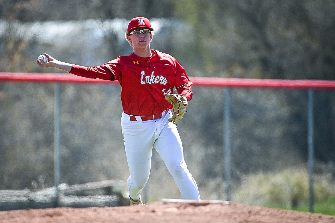 Lakers AA third baseman Luke Nikunen (12) throws across the diamond for an out against the Cranbrook Bandits at Griffin Field on Saturday, April 20. (Casey Kreider/Daily Inter Lake)