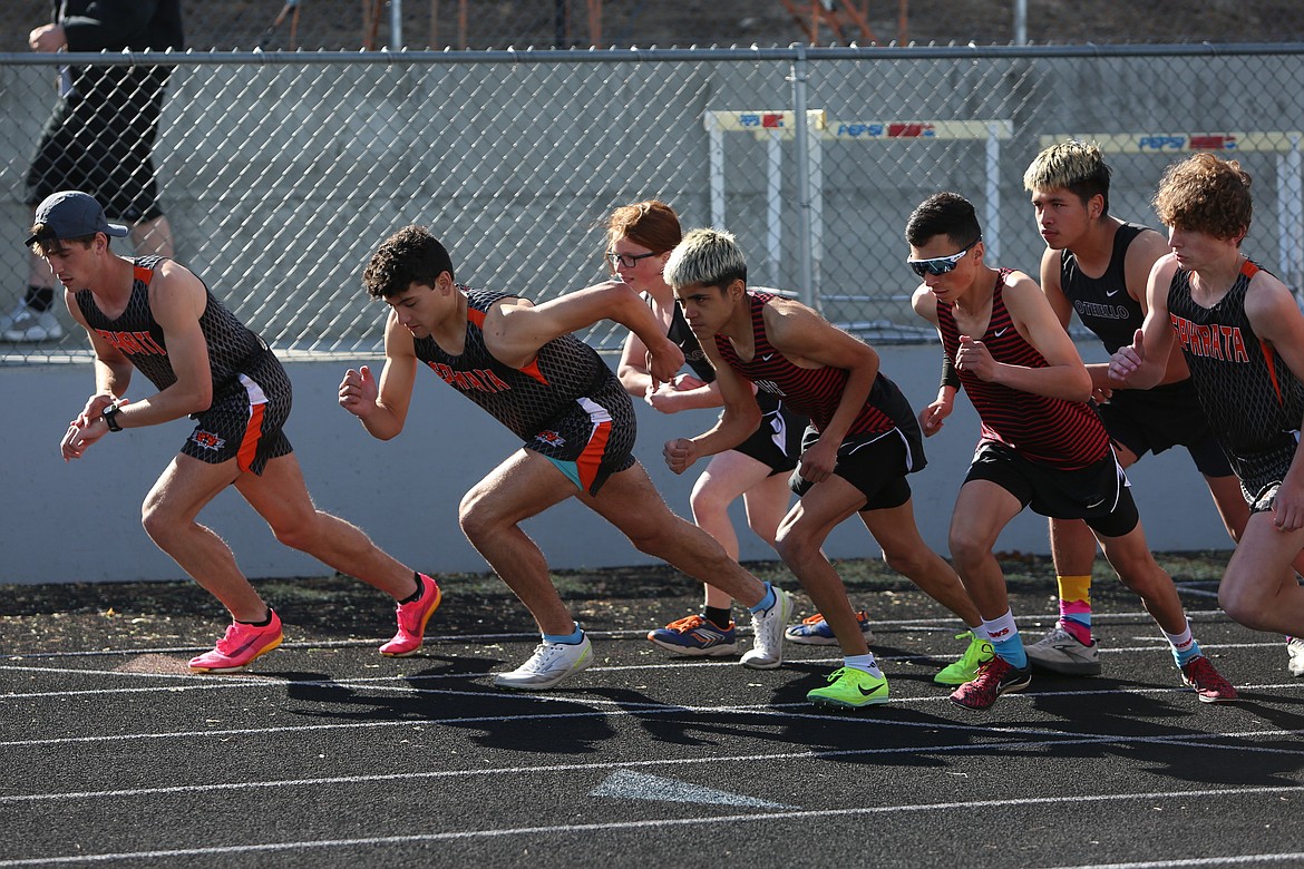 Ephrata and Othello runners meet at the starting line ahead of the 1,600-meter run at Thursday’s Central Washington Athletic Conference meet in Ephrata.