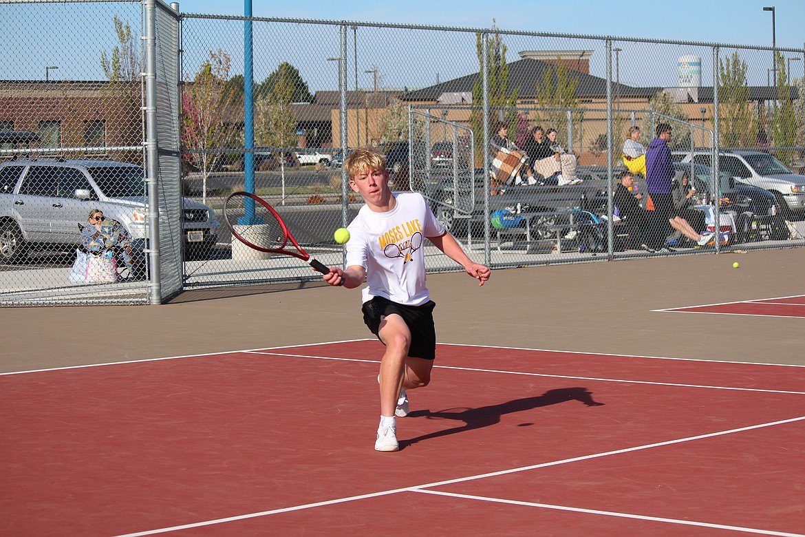 Sam Molitor sets up the volley in his singles win Thursday against Wenatchee.
