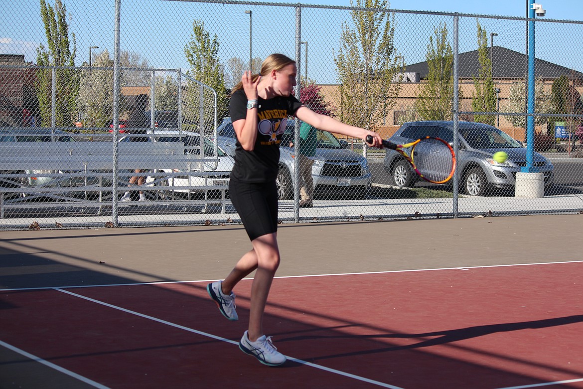 The Moses Lake girls tennis team swept the doubles matches against Wenatchee, but were swept in the singles for a 4-3 dual loss. Baylee Bates drives the ball in her singles match.