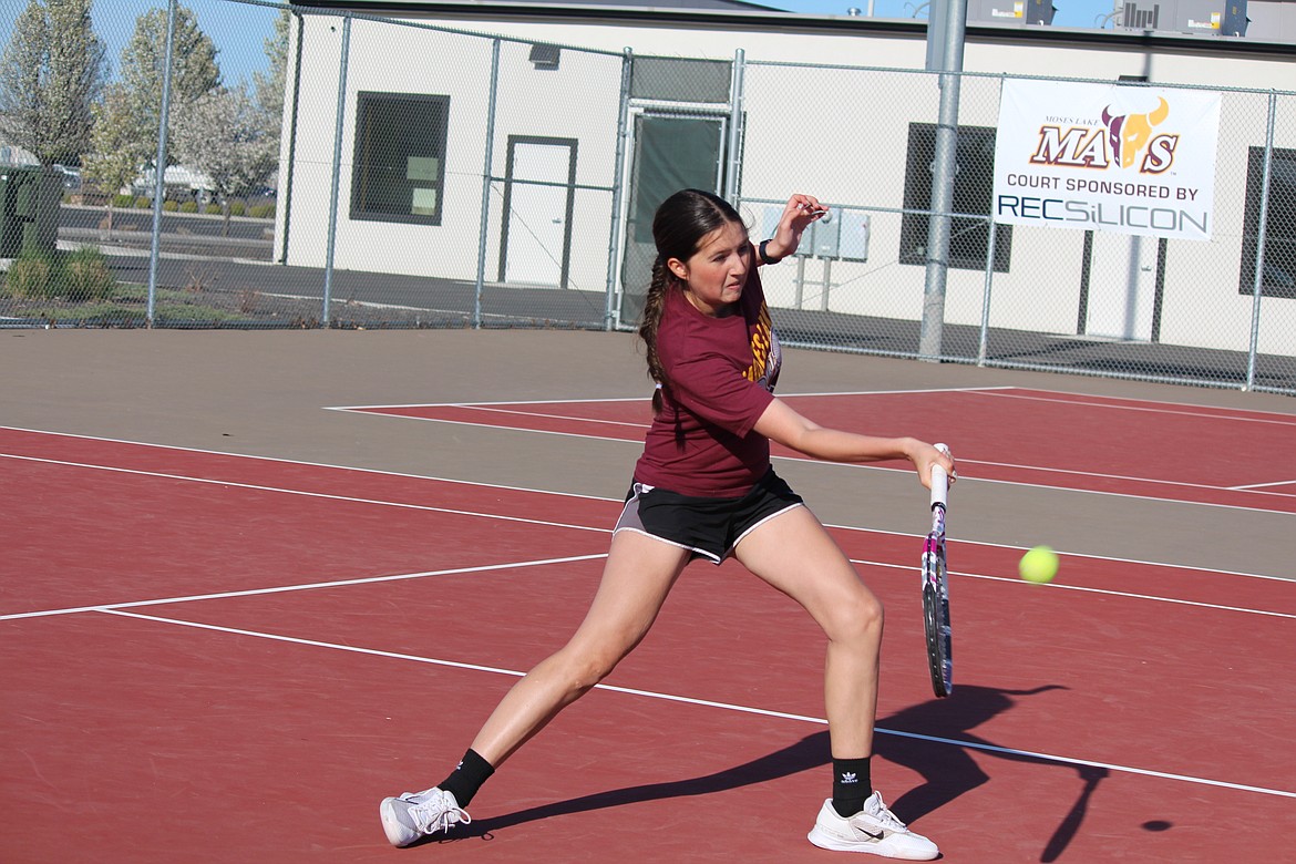 Maddie McDonald digs out the volley in her match against Wenatchee. McDonald and Elise Miles won their doubles match.