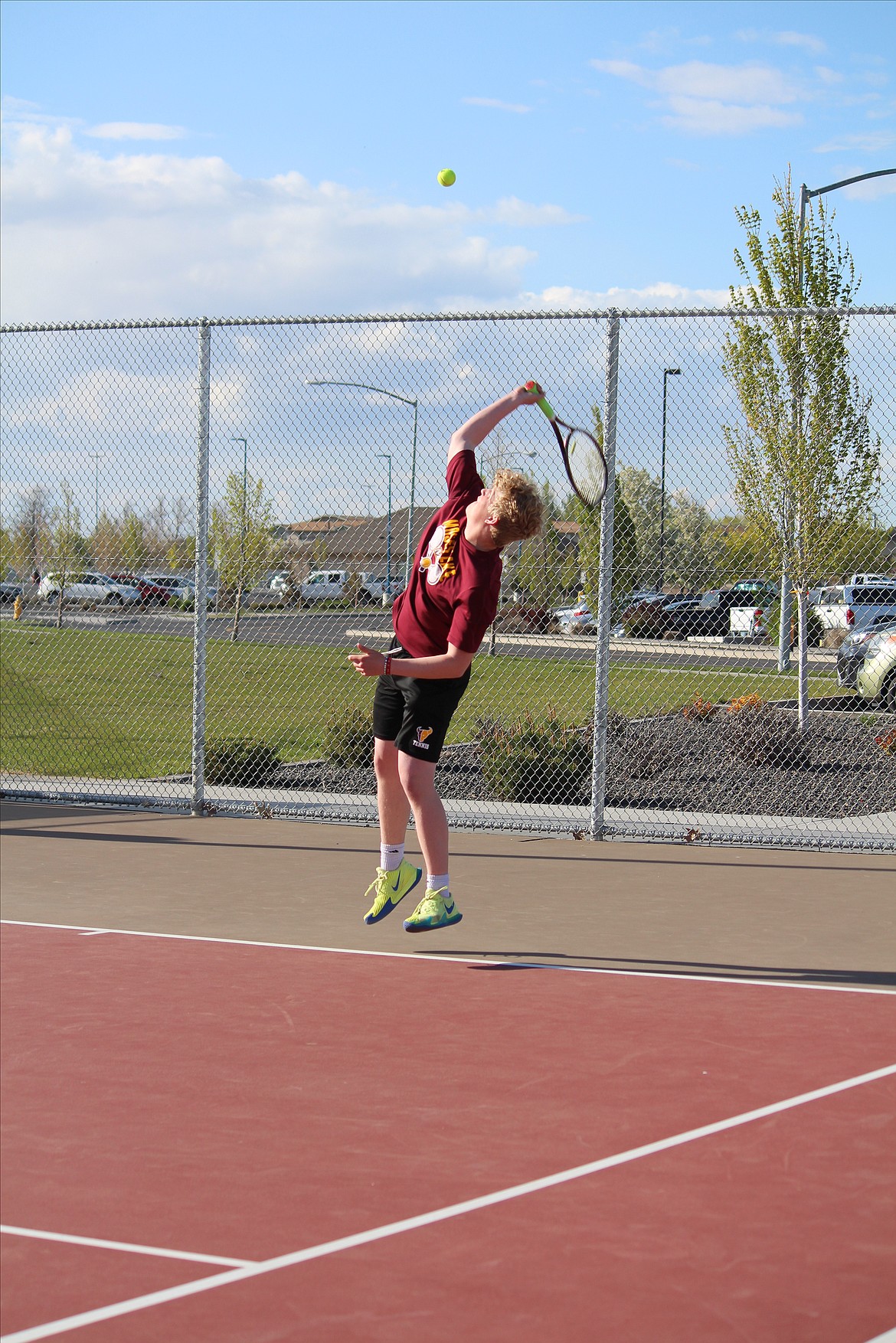 Colin Stanberry goes up for the serve.