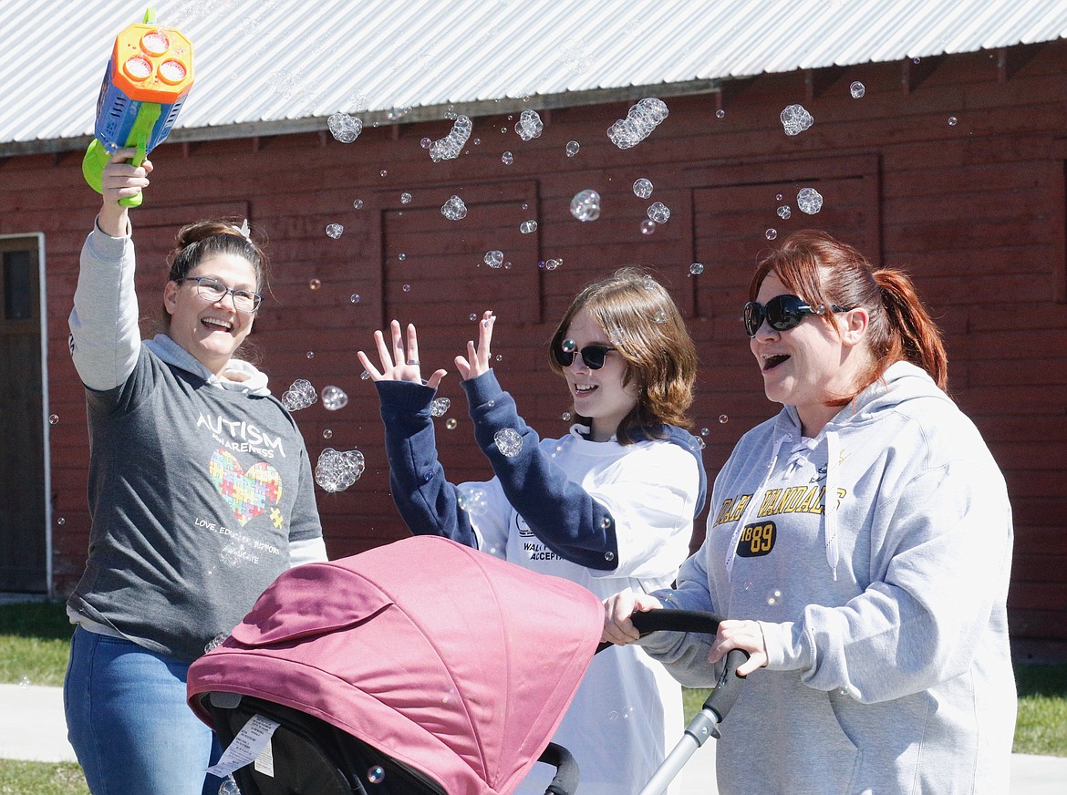 Community members walked a mile Saturday to support autism acceptance.