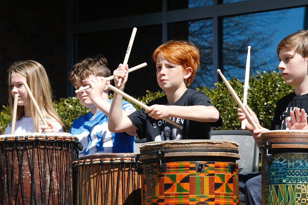 Sorensen Magnet School students play the drums Saturday as part of the Earth Day celebration at the Coeur d’Alene Public Library.