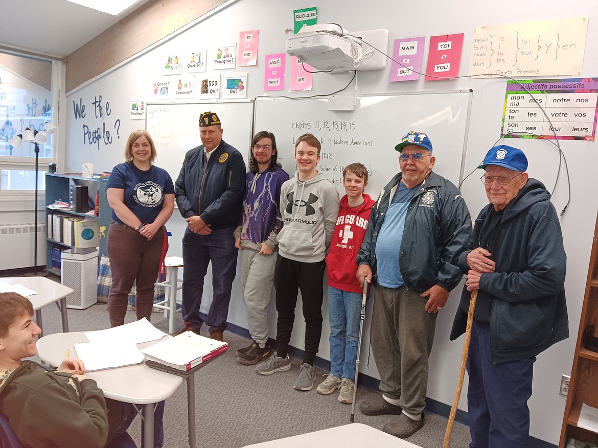 Fronm left, Mrs. Vickey Nytes, Joe Griffith with American Legion Post 13 in St. Regis. 8th grade students Connor Jordan, Ethan Durovey, Wyatt Doughty, along with Herman Berneking (class of 1962), and Jim DeBree with the Veterans of Foreign Wars Post 6238 in Superior. The 3 students were this year’s winners of the School Awards Program. (Monte Turner/Mineral Independent)