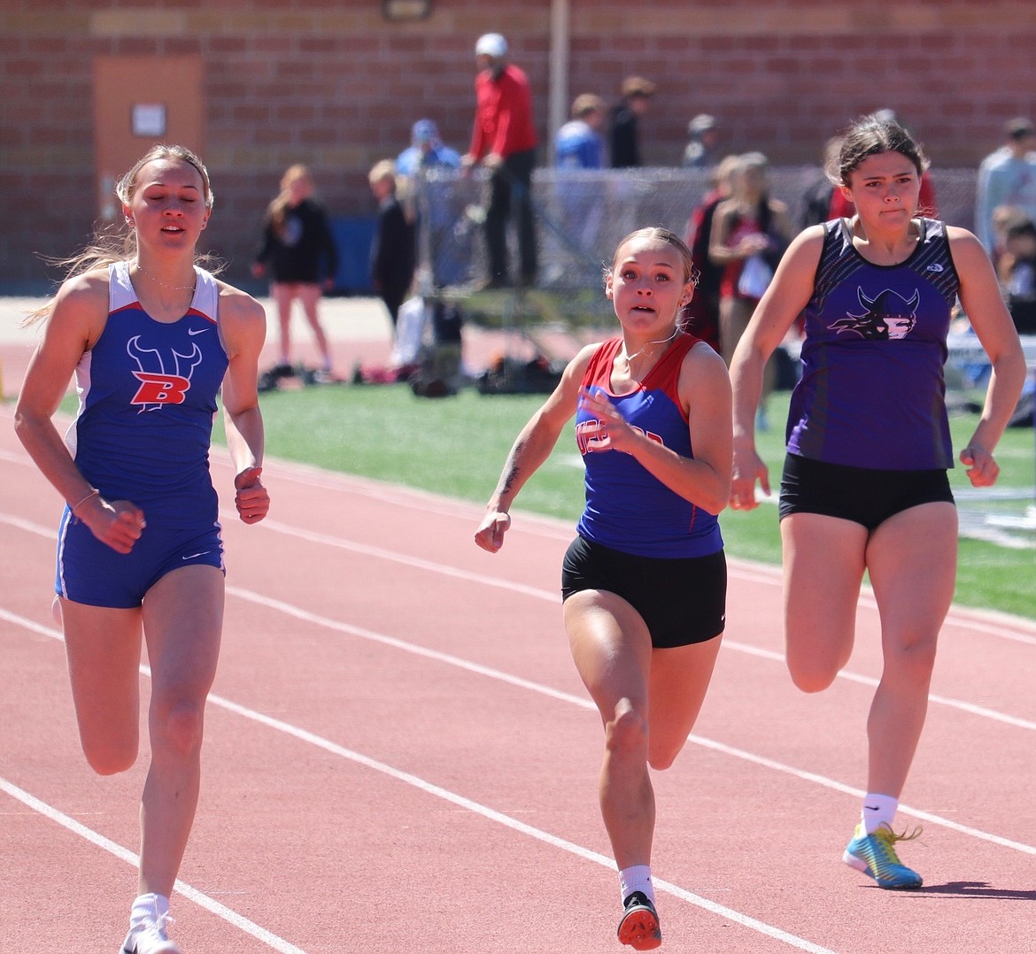 Superior sprint Alysha Ryan (center) competes in the women's 100 meter dash at this year's Seeley-Swan Invitational track meet in Missoula.  (Photo by Kami Milender)