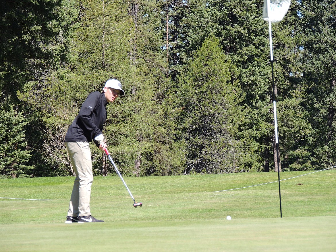 Thompson Falls senior Cael Thilmony watches a put head toward the cup at River's Bend Golf Course during this past Saturday in the Gary Thompson Invitational.  (Photo by Doree Thilmony)