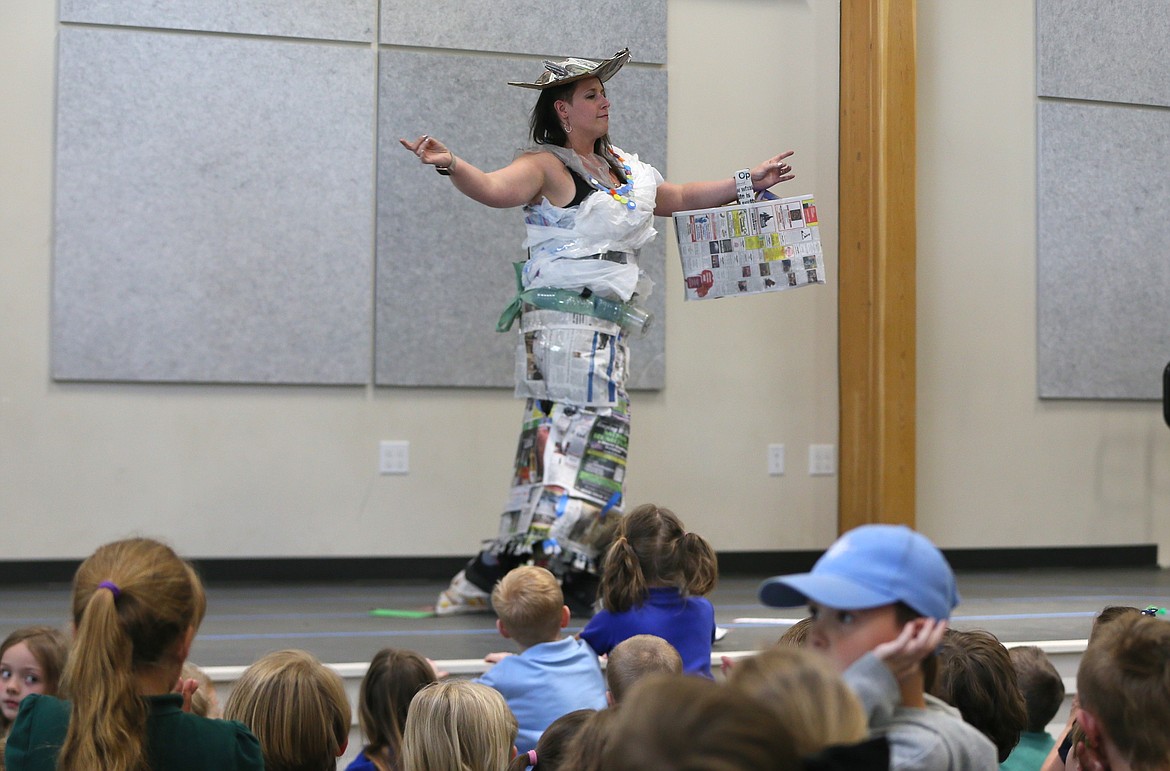 Middle school English language arts and social studies teacher Heather Lundy models a newspaper dress Monday at the Hayden Canyon Charter School Trashin' Fashion Show.