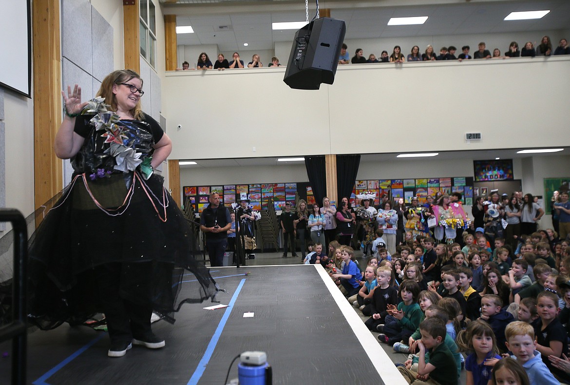Middle school English language arts instructor Kristin Gibney showcases an upcycled trampoline dress Monday at the Hayden Canyon Charter Trashin' Fashion Show.