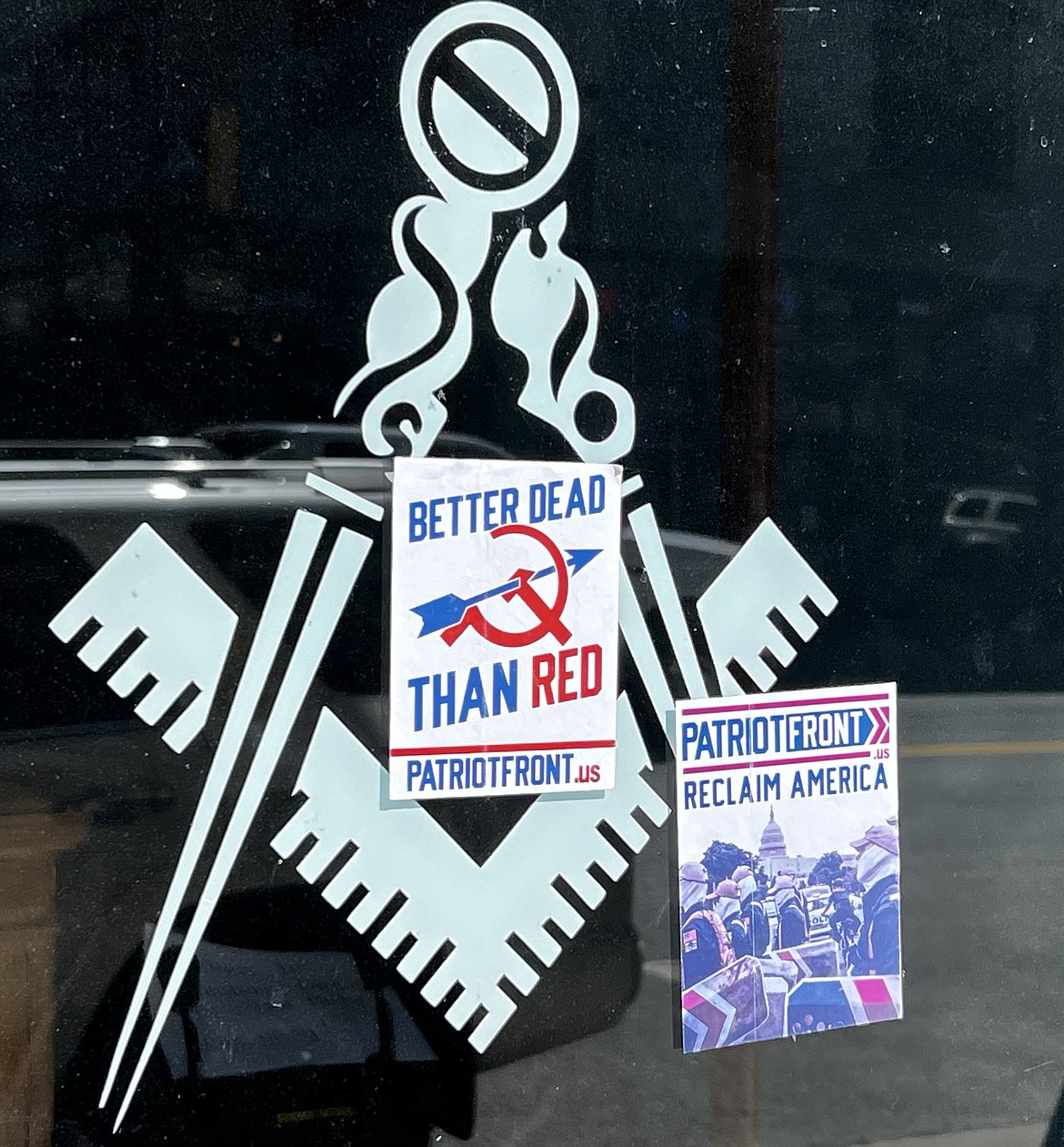 Stickers from white nationalist group Patriot Front, were placed on the windows of several businesses and buildings in downtown Wallace, including the Masonic Lodge. Two men were cited for placing the stickers.