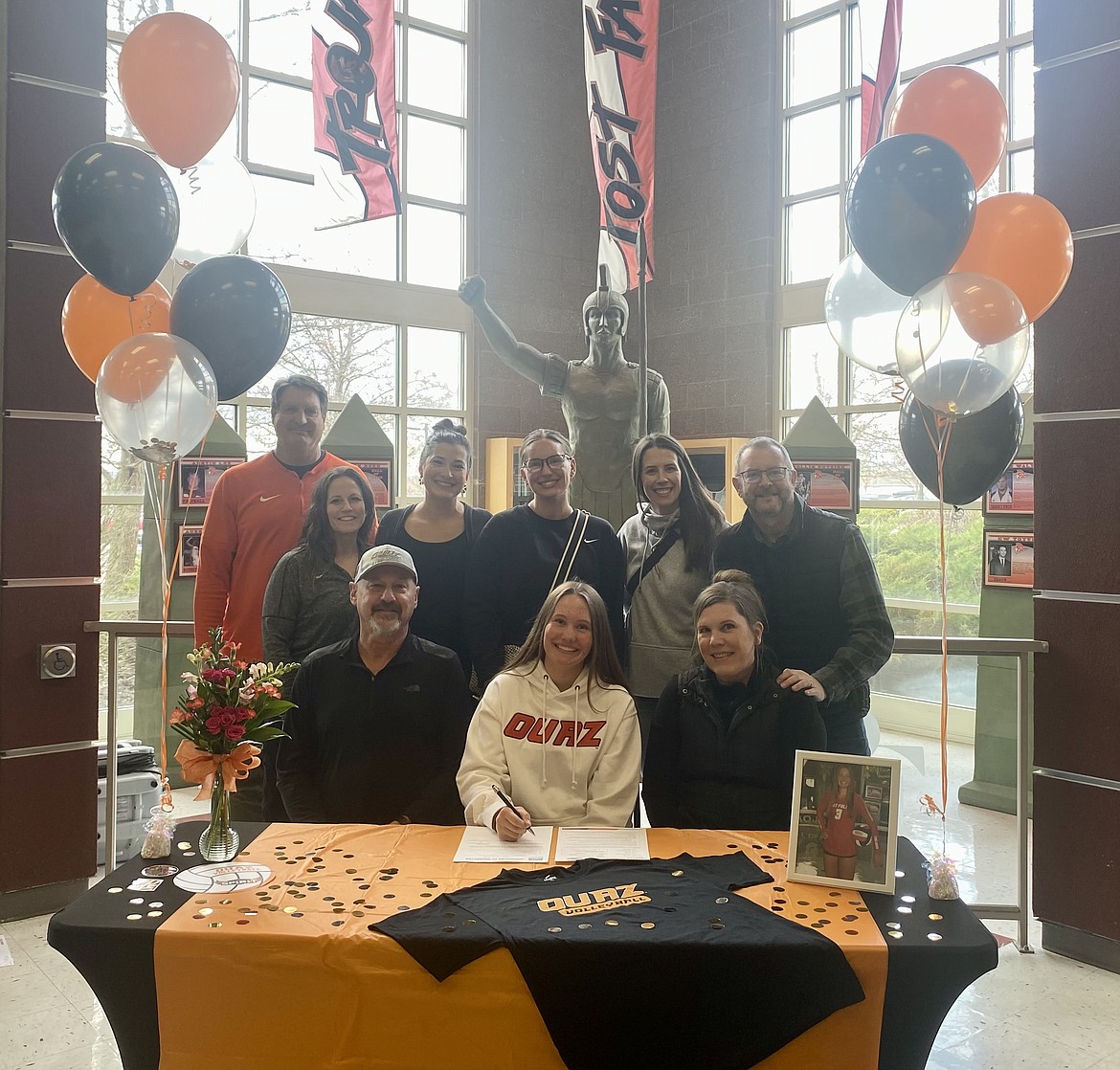 Courtesy photo
Post Falls High senior Jenna Sarff recently signed a letter of intent to play volleyball at NAIA Ottawa University in Surprise, Ariz. Seated from left are Hal Sarff, Jenna Sarff and Shannon Anderson; and standing from left, Craig Christensen (Post Falls High athletic director), Willow Hanna (Post Falls High head volleyball coach), Natalie Mueller, Tessa Sarff, Casey Cornett and Daniel Anderson.