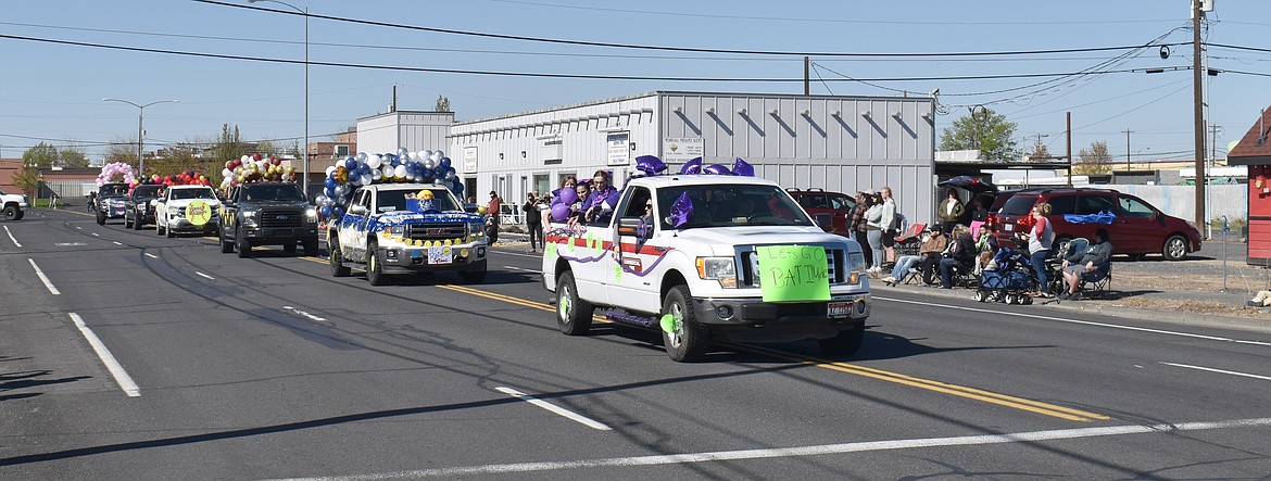 Youth baseball and softball teams whoop and holler their way down Fourth Avenue Saturday in the Moses Lake Youth Parade, launching the 2024 Little League season.