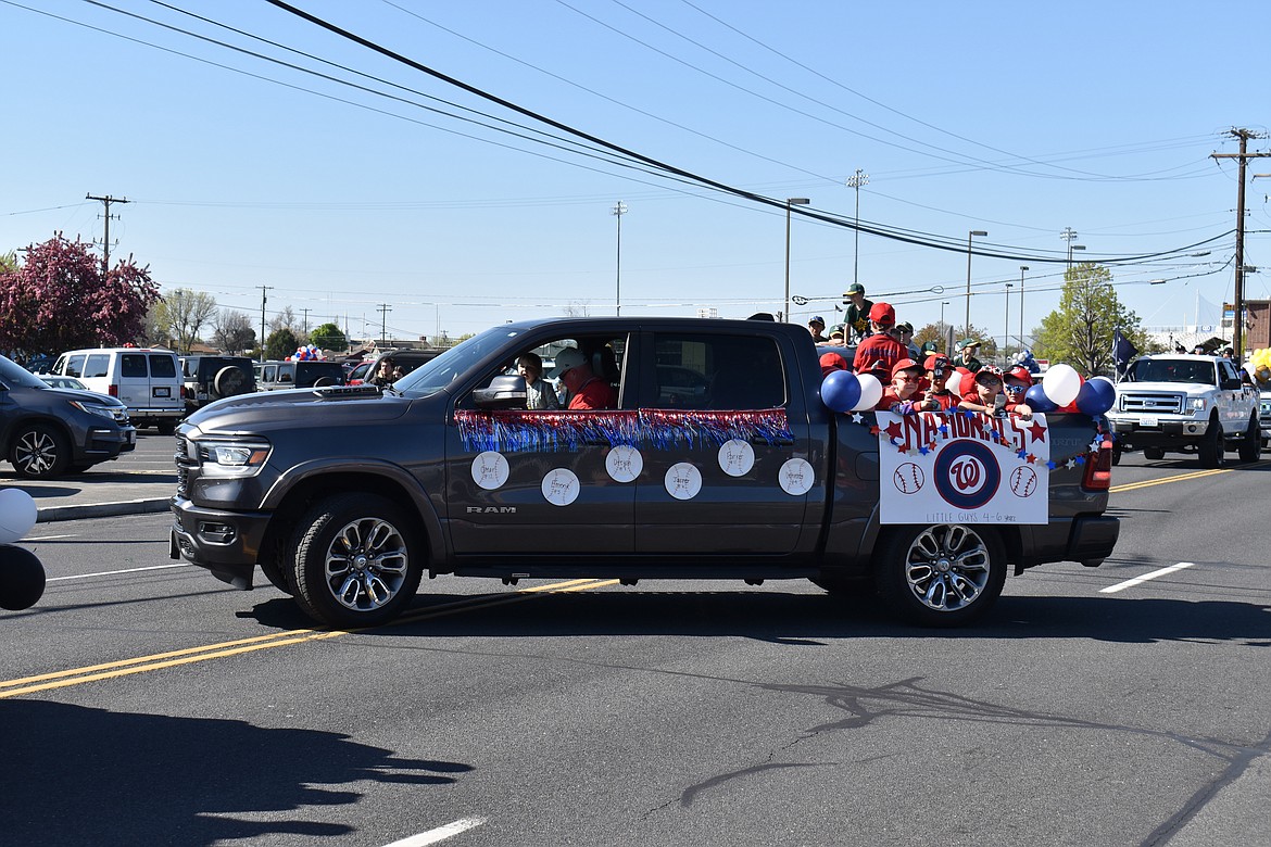 A truckload of baseball players eases out into the Moses Lake Youth Parade Saturday morning.