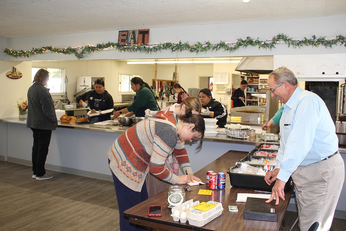 Doug Smith works the cash box at the last taco sale of the school year at the Northwest Indian Bible School. 4 Indian Taco sales take place and last Mondays was to raise money for the high school graduation. (Monte Turner/Mineral Independent)