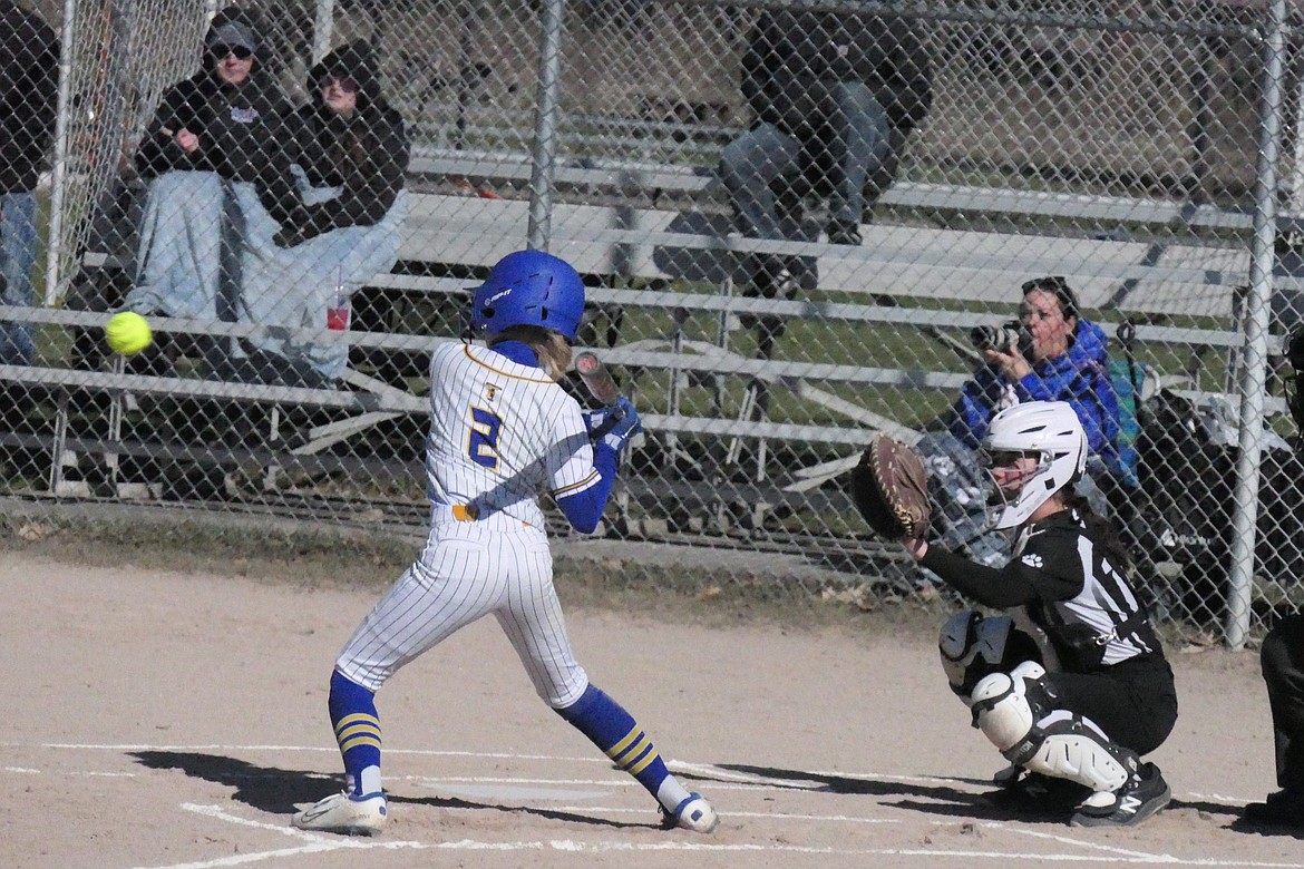 Thompson Falls Lady Hawks McKenzie Robinson eyes an incoming pitch during the Hawks game with Mission-Arlee-Charlo Saturday morning in T Falls. (Chuck Bandel/VP-MI)