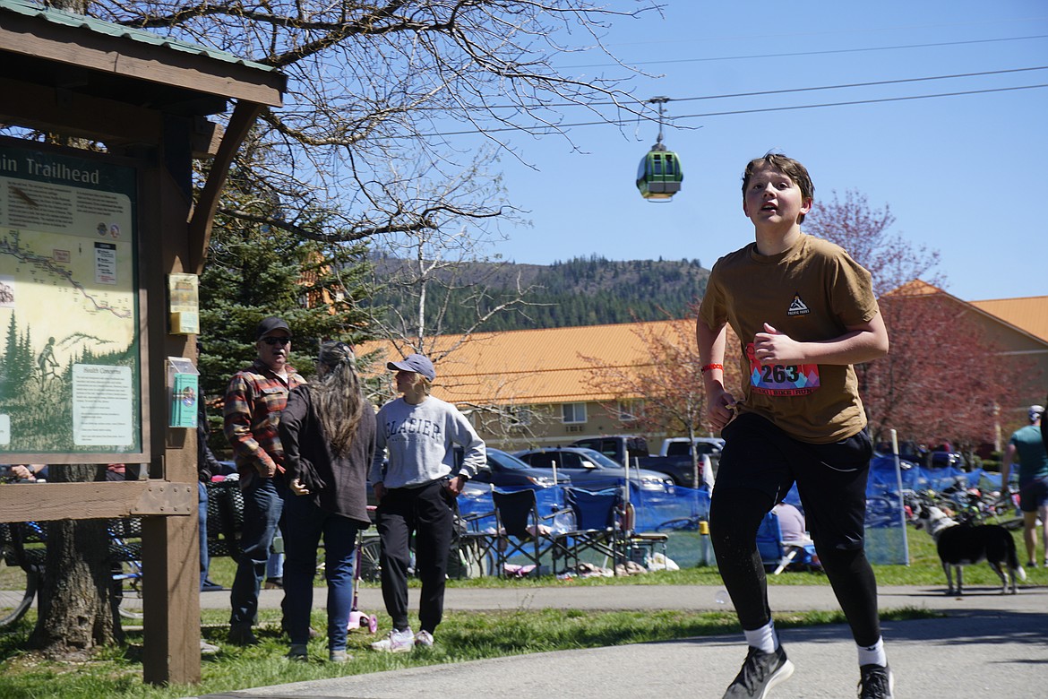 Less than a minute separated the winners in the children's division of the Leadman Triathlon.
Dax Johnson, of Spokane, runs during the Leadman Triathlon Saturday.