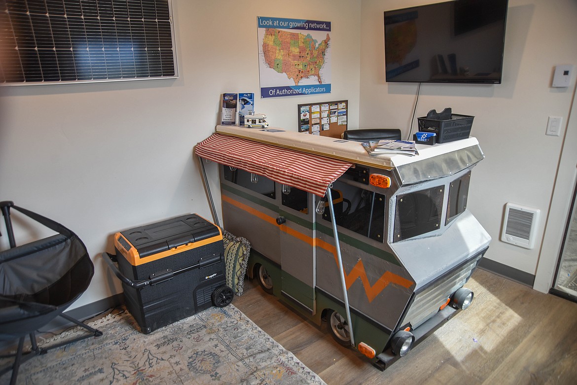 Nikk McWhorter, owner of North Star RV Roofs, built a front office desk to model a RV, including the sprayed own roof. (Kate Heston/ Daily Inter Lake)