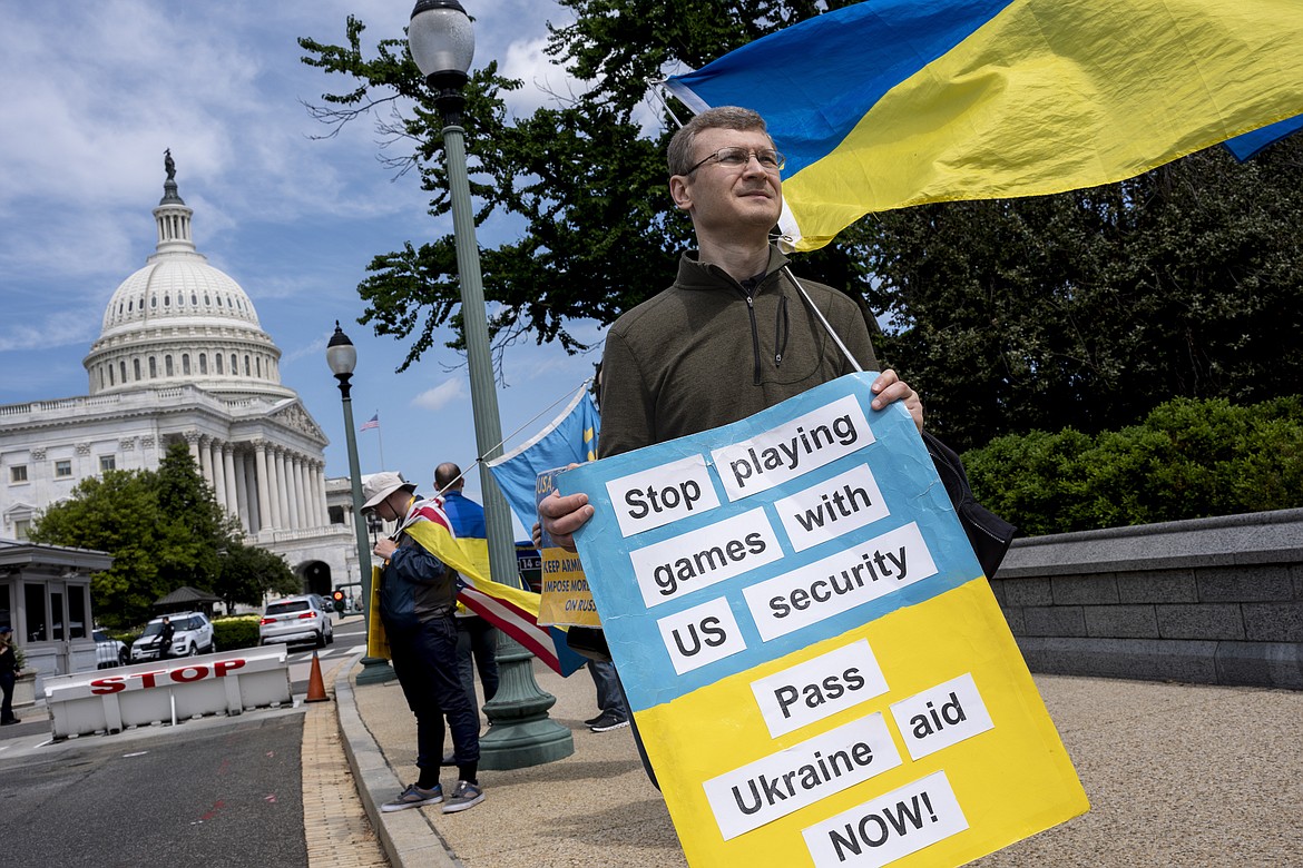 Activists supporting Ukraine, demonstrate outside the Capitol in Washington, April 20, 2024. The Senate is returning to Washington to vote on $95 billion in war aid to Ukraine and Israel. They are taking the final steps in Congress to send the legislation to President Joe Biden's desk after months of delays and contentious internal debate over how involved the United States should be abroad. (AP Photo/J. Scott Applewhite)