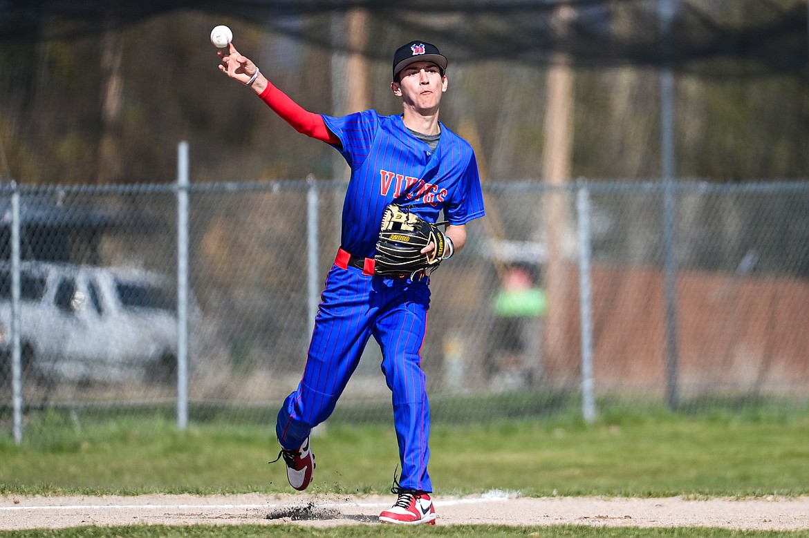 Bigfork third baseman Hayden Mayer (8) throws across the diamond for an out against Whitefish at ABS Park in Evergreen on Tuesday, April 23. (Casey Kreider/Daily Inter Lake)