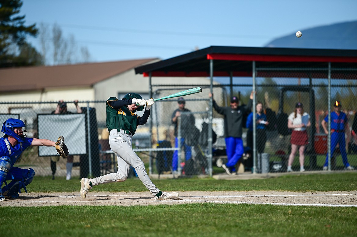 Whitefish's Drew Queen connects on a RBI triple against Bigfork at ABS Park in Evergreen on Tuesday, April 23. (Casey Kreider/Daily Inter Lake)