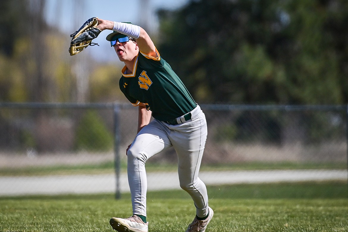 Whitefish right fielder Luke Dalen (2) squeezes a fly ball against Bigfork at ABS Park in Evergreen on Tuesday, April 23. (Casey Kreider/Daily Inter Lake)