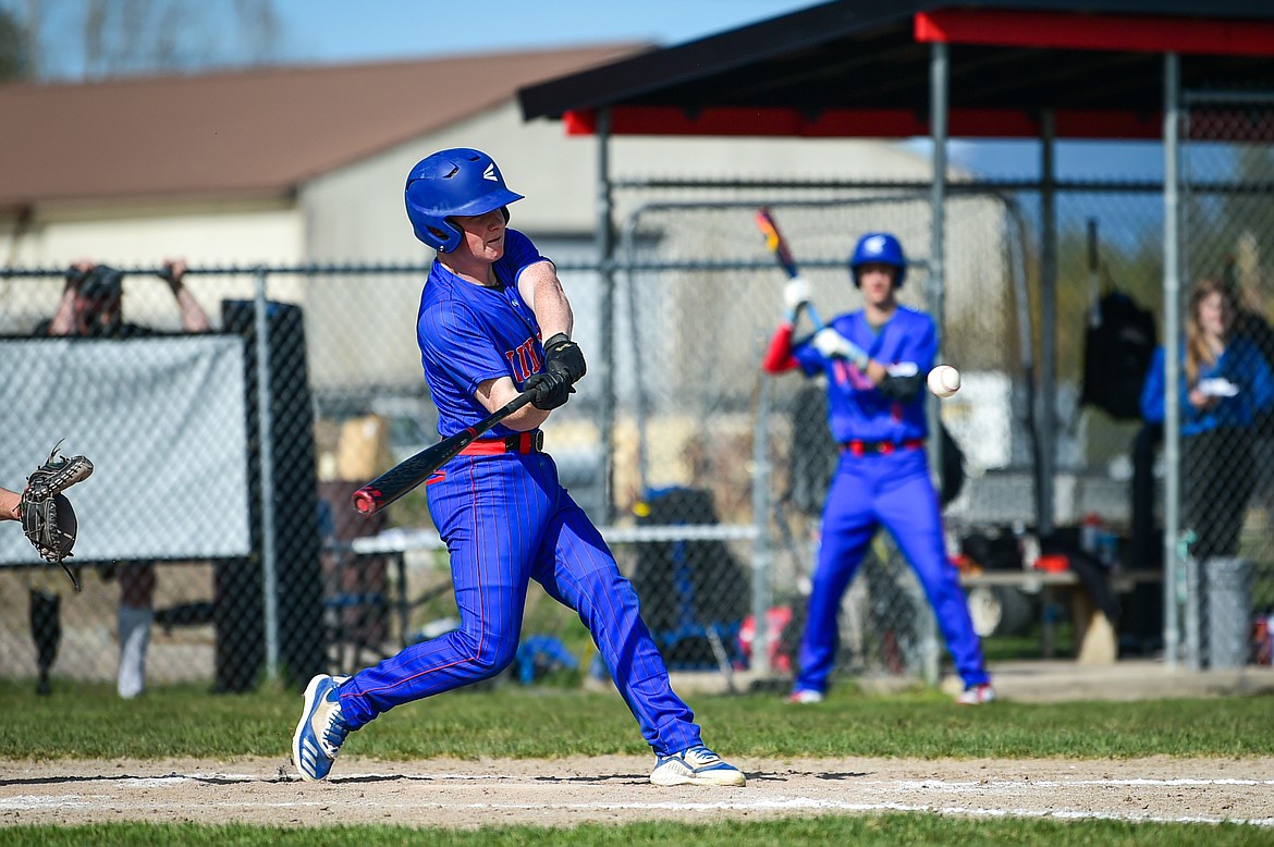 Bigfork's Liam Benson knocks in a run in the seventh inning against Whitefish at ABS Park in Evergreen on Tuesday, April 23. (Casey Kreider/Daily Inter Lake)