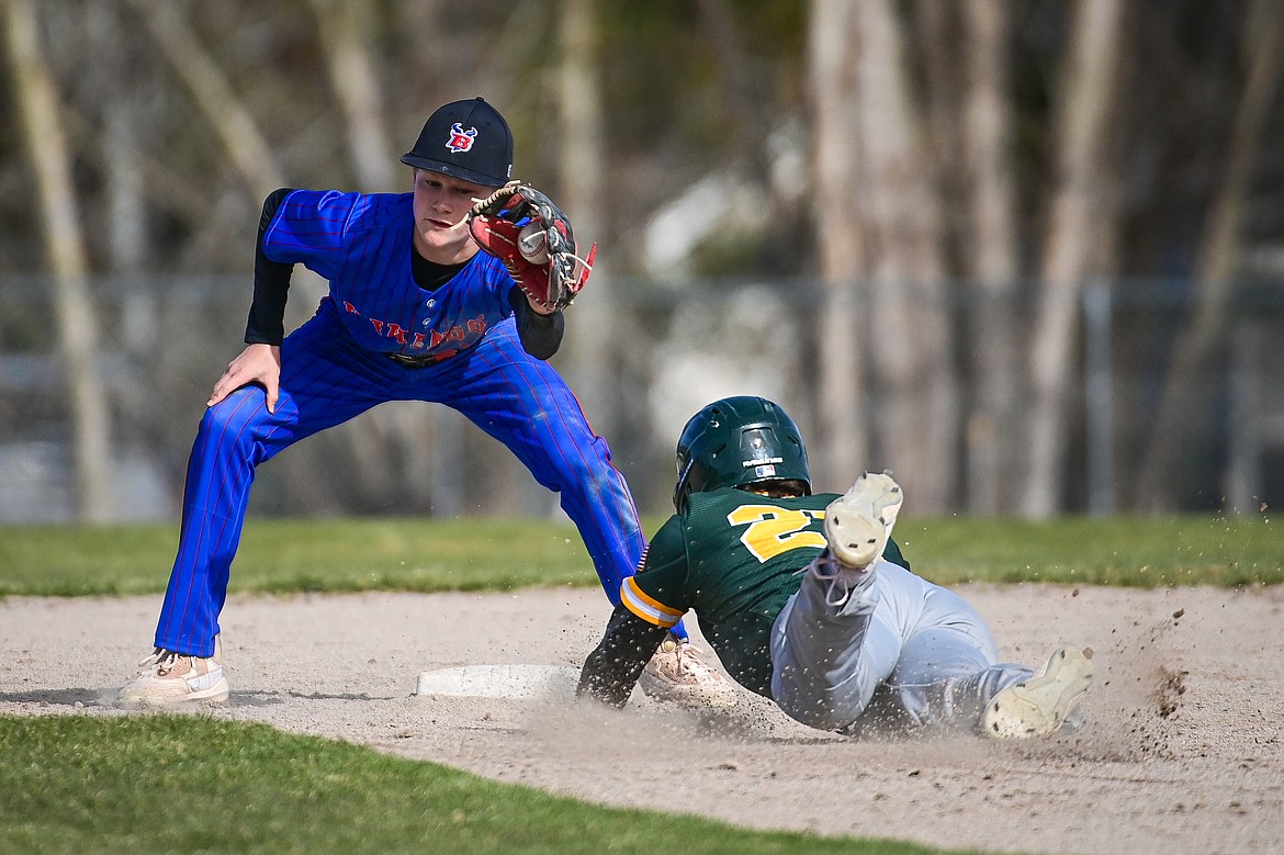 Bigfork shortstop Grady Campbell (3) puts the tag down to nab Whitefish's Michael Miller (27) stealing second base at ABS Park in Evergreen on Tuesday, April 23. (Casey Kreider/Daily Inter Lake)
