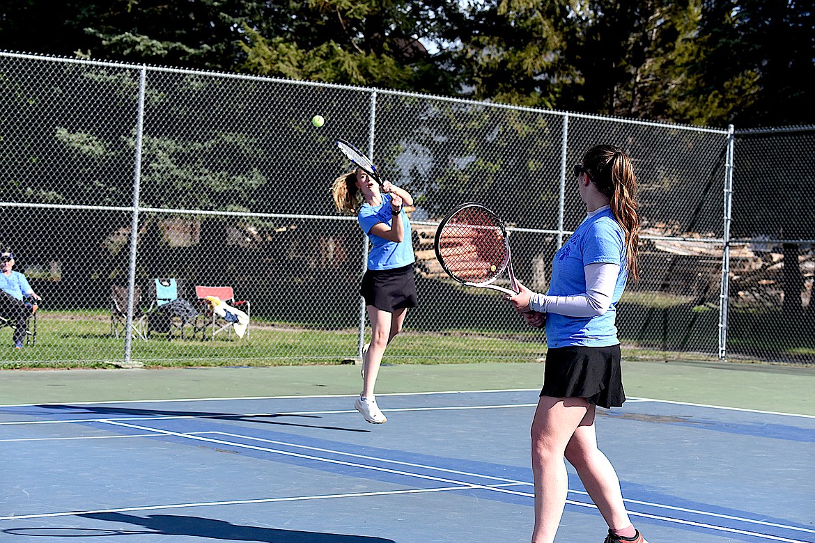 Libby's Kayla Hoff returns a shot against Stevensville as her doubles teammate Savanah Lucas watches in the quarterfinals Friday, April 19, 2024, at the Libby Tennis Invitational. (Scott Shindledecker/The Western News)