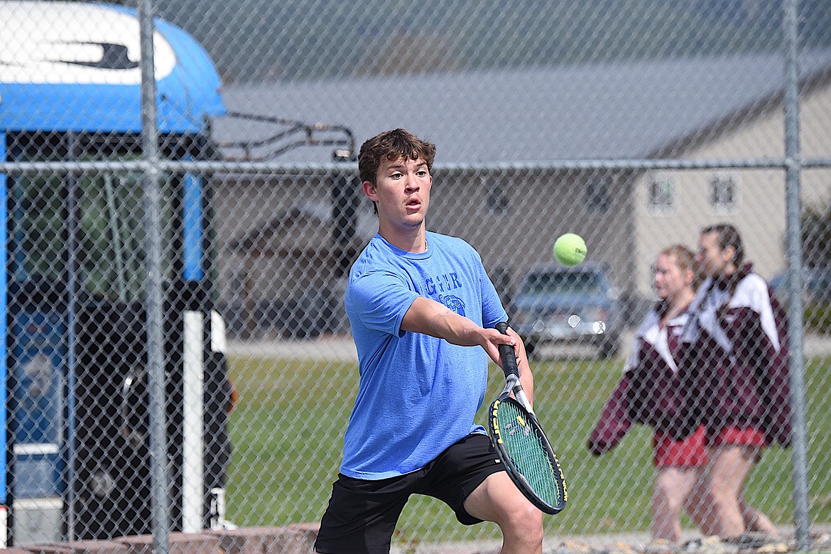 Libby's Tristan Andersen lunges to return a shot against Loyola's Nathaniel Read-Smith in the quarterfinals of the Boys Singles 2s bracket Friday, April 19, 2024, at the Libby Invitational. (Scott Shindledecker/The Western News)
