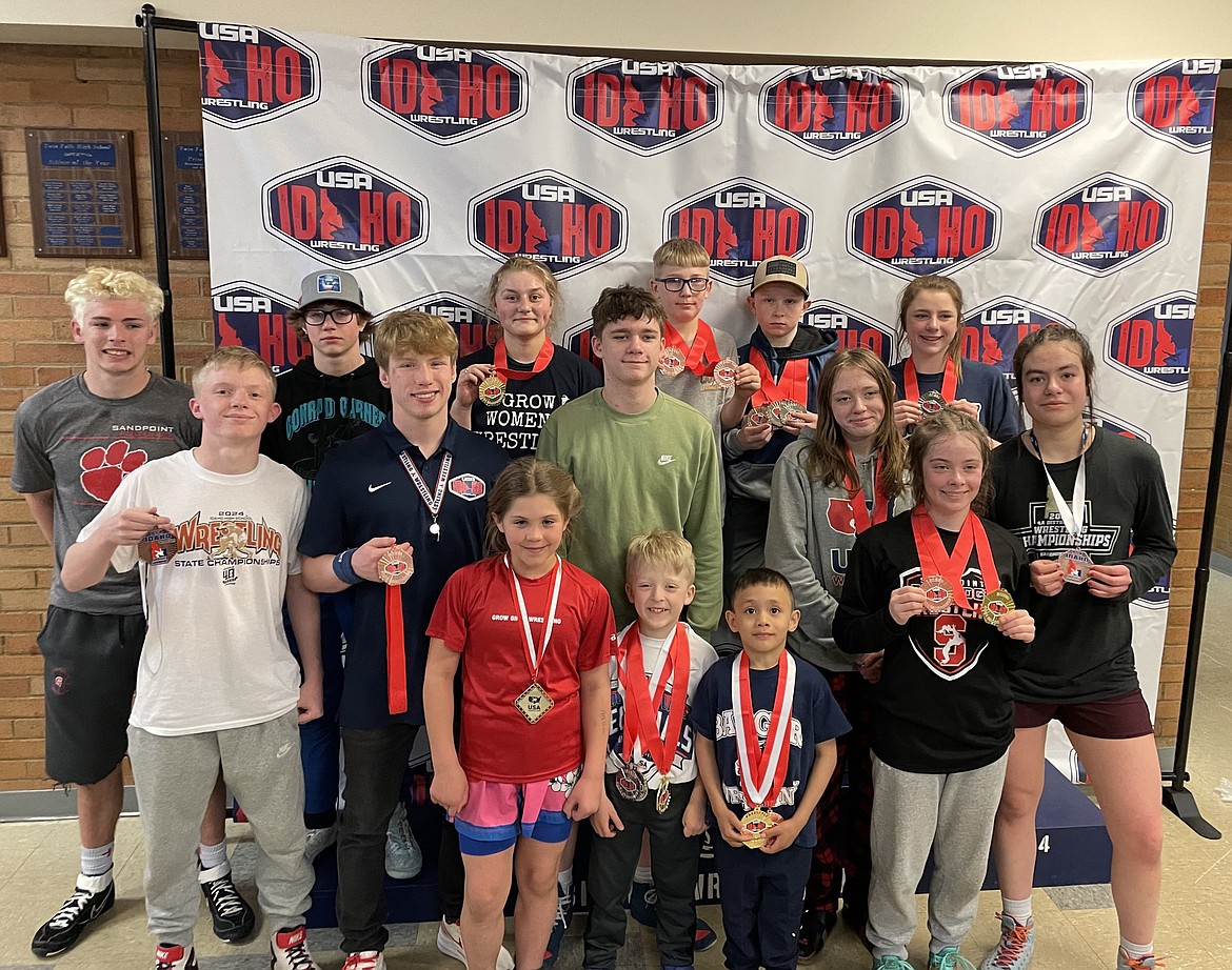 Sandpoint and Bonners Ferry wrestlers show off their hardware from the Idaho Freestyle and Greco-Roman State Championships held April 19-20 at Twin Falls High. Back row, from left, Lucas Johansen, Eivind Falck, Savannah Rickter, Damien Therrien, Dalton Reghr, and Aubree Graves. Middle row, from left, Aidan Rork, Shane Sherrill, James Graves, Melody Graves, and Kaysha Kimura. Bottom row, from left, Gabby Nagel, Titan Richards, Kai Fusco, and Mackenzee Donenfeld.