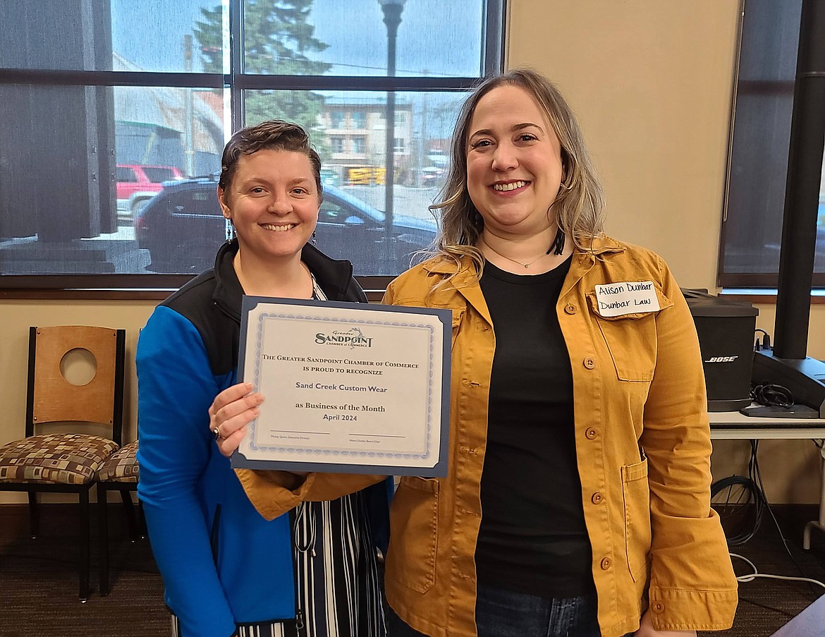Elli Vahrenwald of Sand Creek Custom Wear is presented with the Greater Sandpoint Chamber of Commerce's Business of the Month Award for April 2024 by Alison Dunbar, chamber board chair.