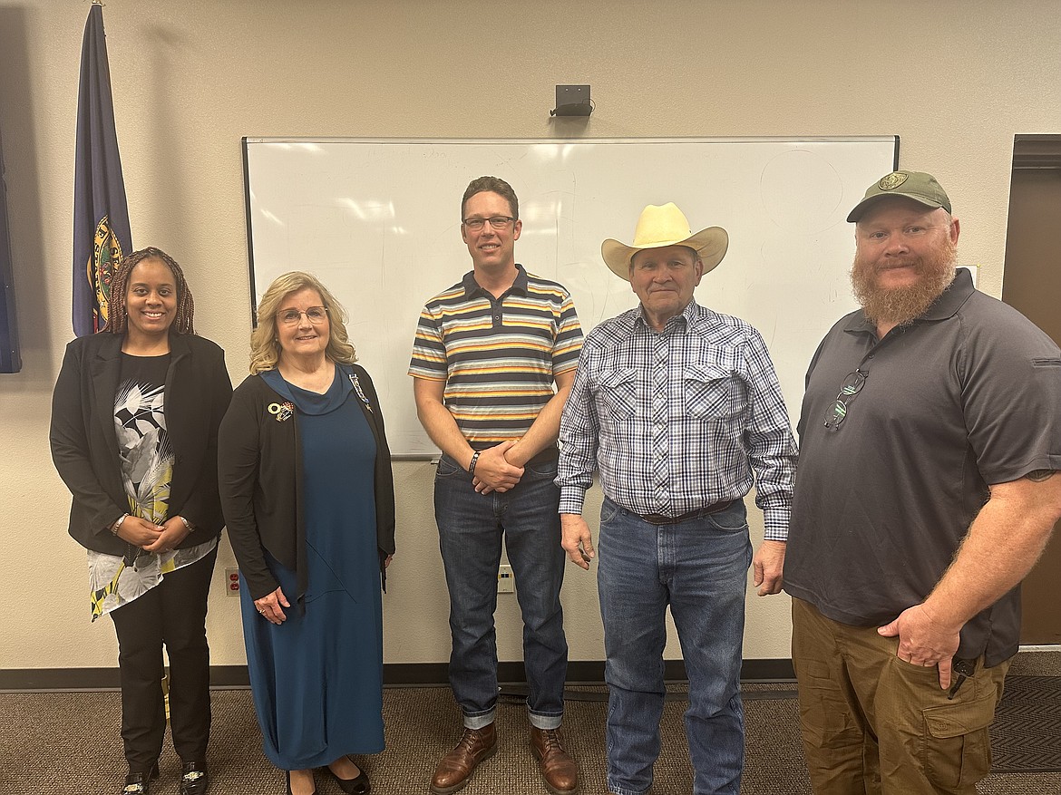 Bonner County commissioners pose with  Wild Horse Chapter of the Daughters of the American Revolution member Susan Costa and director of Veteran Services Tom Lindley during Tuesday's meeting.